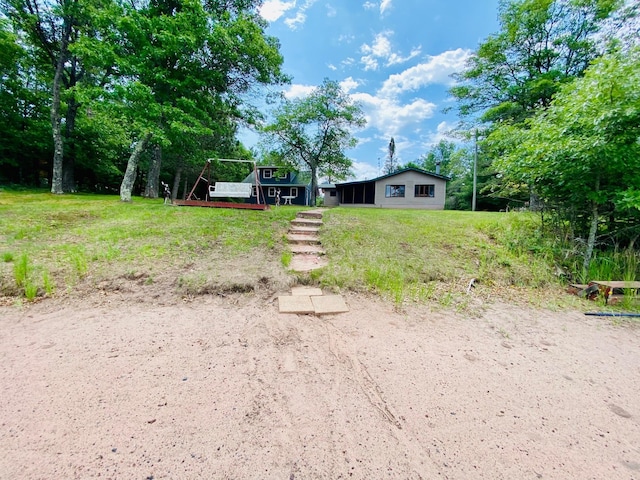 W7486 Burval Dr, Minong, WI 54859 - view of yard with a deck, stairs, and view of scattered trees