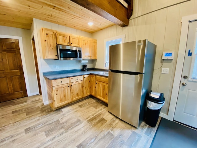 W7486 Burval Dr, Minong, WI 54859 - kitchen featuring appliances with stainless steel finishes, dark countertops, light wood-style flooring, light brown cabinetry, and wood ceiling