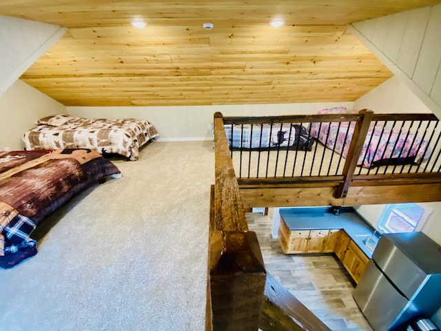 W7486 Burval Dr, Minong, WI 54859 - bedroom featuring wood ceiling, vaulted ceiling, and freestanding refrigerator