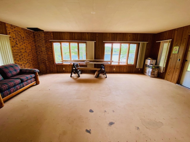W7486 Burval Dr, Minong, WI 54859 - living area with wood walls and concrete flooring
