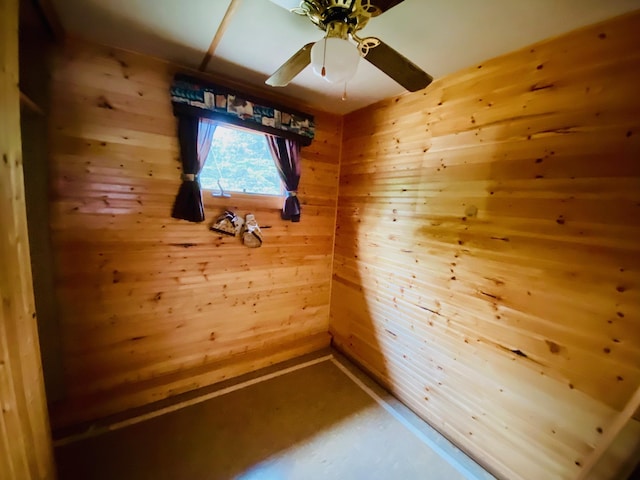W7486 Burval Dr, Minong, WI 54859 - empty room with wood walls and a ceiling fan