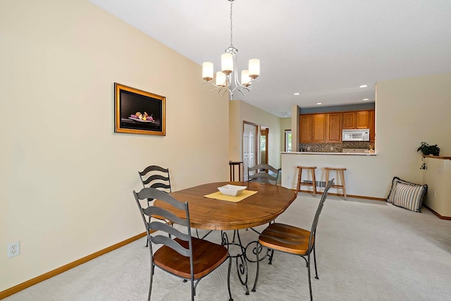 1112 Iris Dr, White Bear Twp, MN 55127 - dining room with light carpet, a chandelier, and recessed lighting