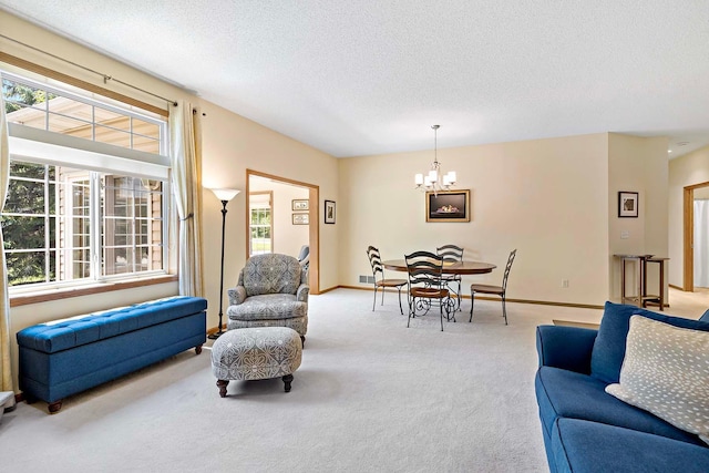 1112 Iris Dr, White Bear Twp, MN 55127 - carpeted living room with a chandelier, healthy amount of natural light, and a textured ceiling