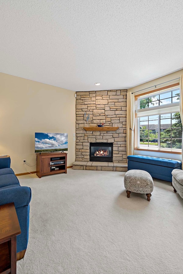 1112 Iris Dr, White Bear Twp, MN 55127 - living area with carpet floors, a textured ceiling, and a fireplace