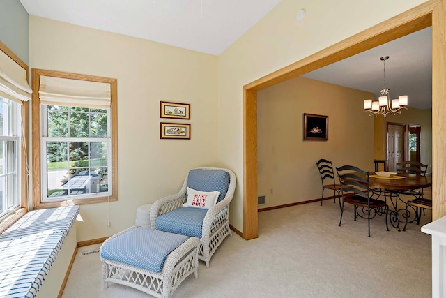 1112 Iris Dr, White Bear Twp, MN 55127 - living area featuring a chandelier and light colored carpet
