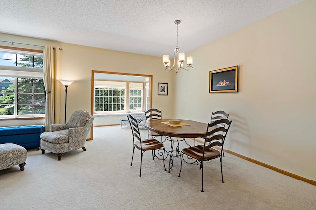 1112 Iris Dr, White Bear Twp, MN 55127 - carpeted dining room with a chandelier, plenty of natural light, and a textured ceiling