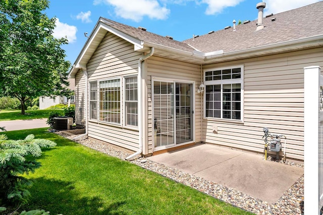 1112 Iris Dr, White Bear Twp, MN 55127 - back of house featuring a patio area, a yard, and roof with shingles