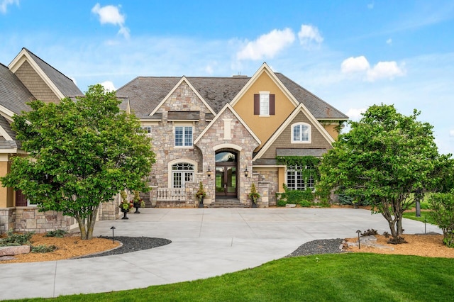 18901 Brookwood Rd, Prior Lake, MN 55372 - view of front of house featuring stone siding, stucco siding, and a front lawn