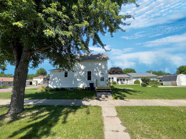 422 Sanborn St, Springfield, MN 56087 - view of front of property featuring a front lawn and a storage unit