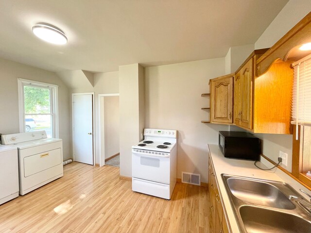 422 Sanborn St, Springfield, MN 56087 - kitchen featuring white electric range, light wood-style floors, washer and clothes dryer, and brown cabinetry