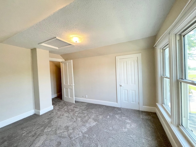 422 Sanborn St, Springfield, MN 56087 - unfurnished bedroom featuring a textured ceiling, attic access, carpet, and a closet