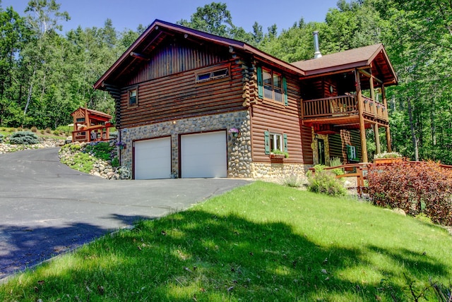 28395 Far N Dr, Nevis, MN 56467 - view of side of property with log exterior, driveway, an attached garage, stone siding, and a balcony