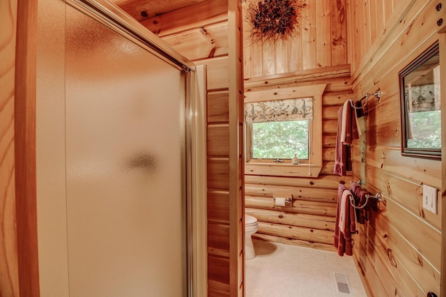 28395 Far N Dr, Nevis, MN 56467 - bathroom featuring rustic walls, healthy amount of natural light, a shower stall, and tile patterned floors