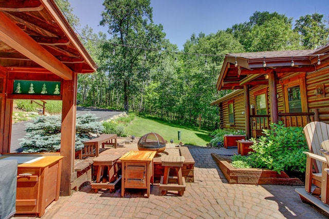 28395 Far N Dr, Nevis, MN 56467 - view of patio / terrace featuring a fire pit