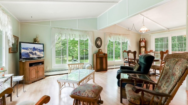 2104 US Highway 8, Stanley Twp, WI 54822 - living room featuring vaulted ceiling, light wood-style floors, a baseboard heating unit, a chandelier, and crown molding