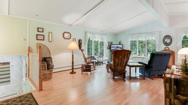 2104 US Highway 8, Stanley Twp, WI 54822 - living area with light wood-style flooring and a baseboard heating unit