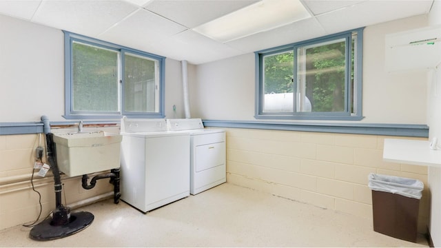 2104 US Highway 8, Stanley Twp, WI 54822 - laundry room featuring separate washer and dryer and concrete block wall