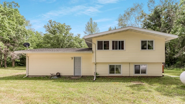 2104 US Highway 8, Stanley Twp, WI 54822 - back of house featuring a yard