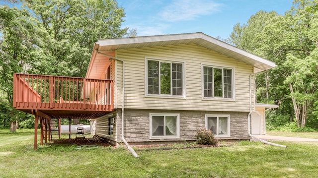 2104 US Highway 8, Stanley Twp, WI 54822 - rear view of house with a deck, a yard, and stairway