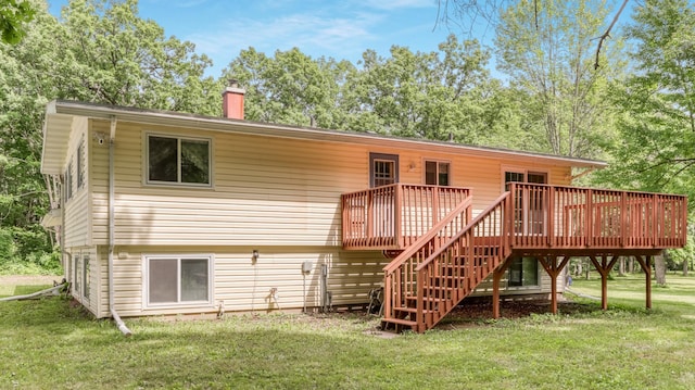 2104 US Highway 8, Stanley Twp, WI 54822 - back of house featuring a yard, a chimney, a deck, and stairway