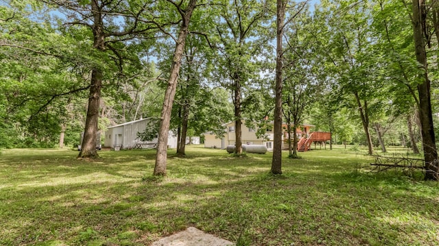 2104 US Highway 8, Stanley Twp, WI 54822 - view of green lawn featuring a deck and stairway