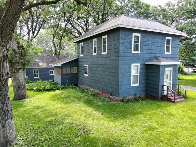 311 Grove St, Redwood Falls, MN 56283 - back of house featuring a lawn