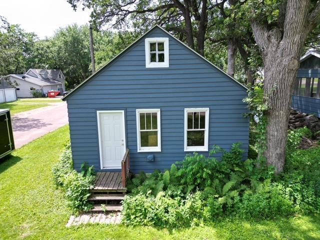 311 Grove St, Redwood Falls, MN 56283 - rear view of house featuring a lawn