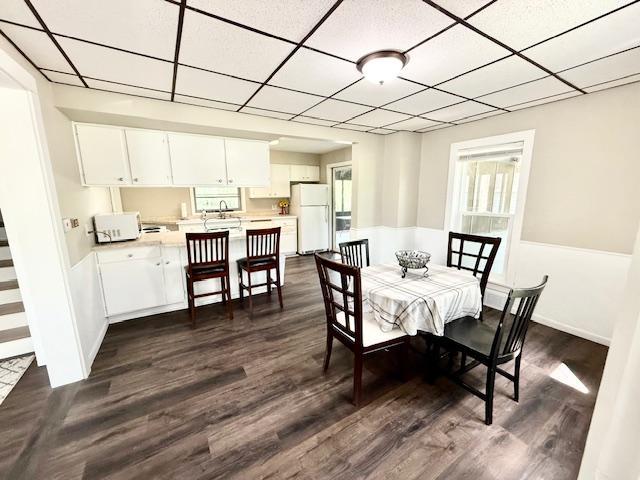 311 Grove St, Redwood Falls, MN 56283 - dining space featuring a drop ceiling and dark wood-type flooring