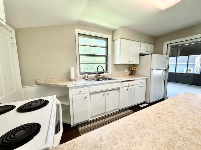 311 Grove St, Redwood Falls, MN 56283 - kitchen featuring white appliances, dark wood-type flooring, white cabinetry, and light countertops