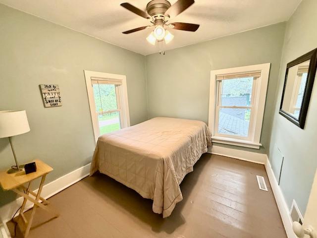 311 Grove St, Redwood Falls, MN 56283 - bedroom featuring dark wood-type flooring and ceiling fan