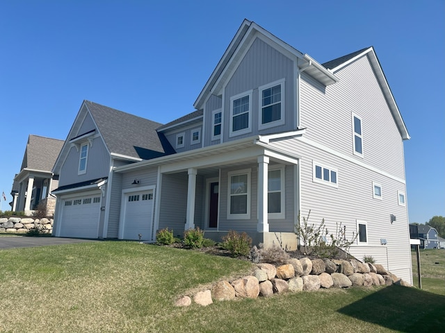 3790 Thrush St, Shakopee, MN 55379 - view of front facade with a front yard, asphalt driveway, covered porch, and an attached garage