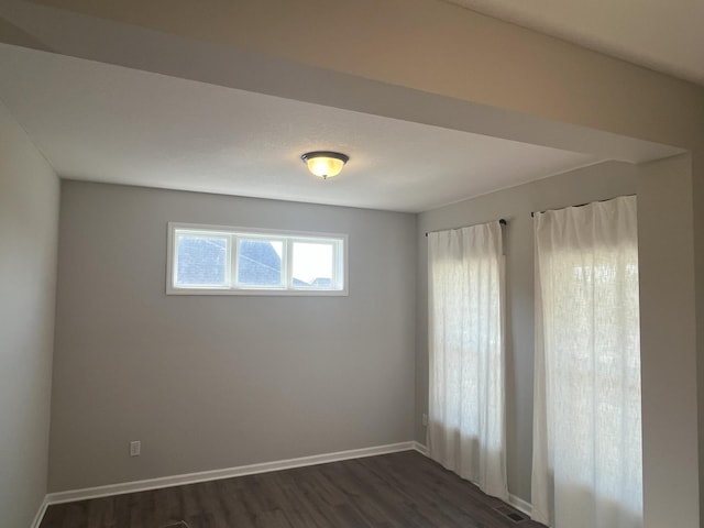3790 Thrush St, Shakopee, MN 55379 - empty room featuring dark wood-type flooring and baseboards