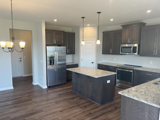 3790 Thrush St, Shakopee, MN 55379 - kitchen with appliances with stainless steel finishes, a kitchen island, a chandelier, dark wood finished floors, and recessed lighting