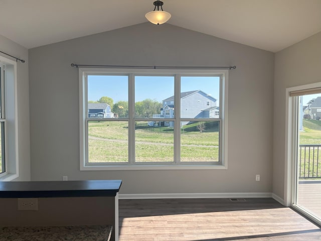 3790 Thrush St, Shakopee, MN 55379 - unfurnished dining area with dark wood-style flooring and vaulted ceiling
