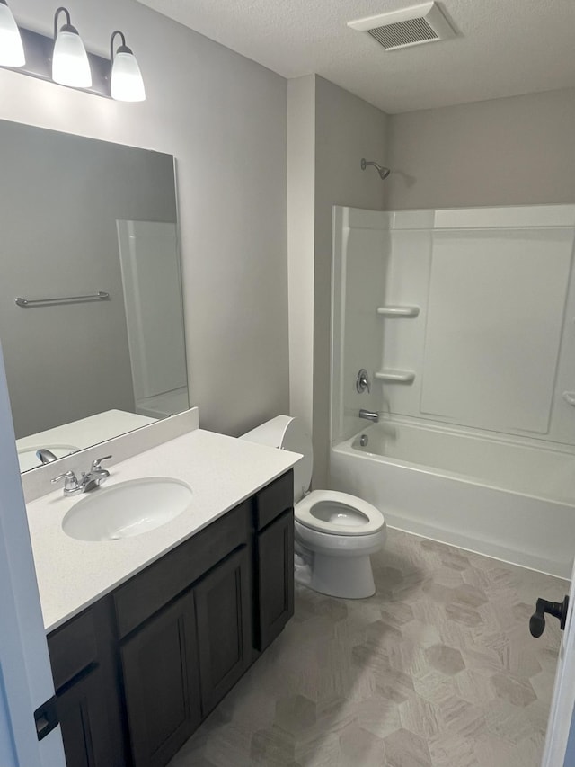 3790 Thrush St, Shakopee, MN 55379 - bathroom with vanity, shower / bathtub combination, and a textured ceiling