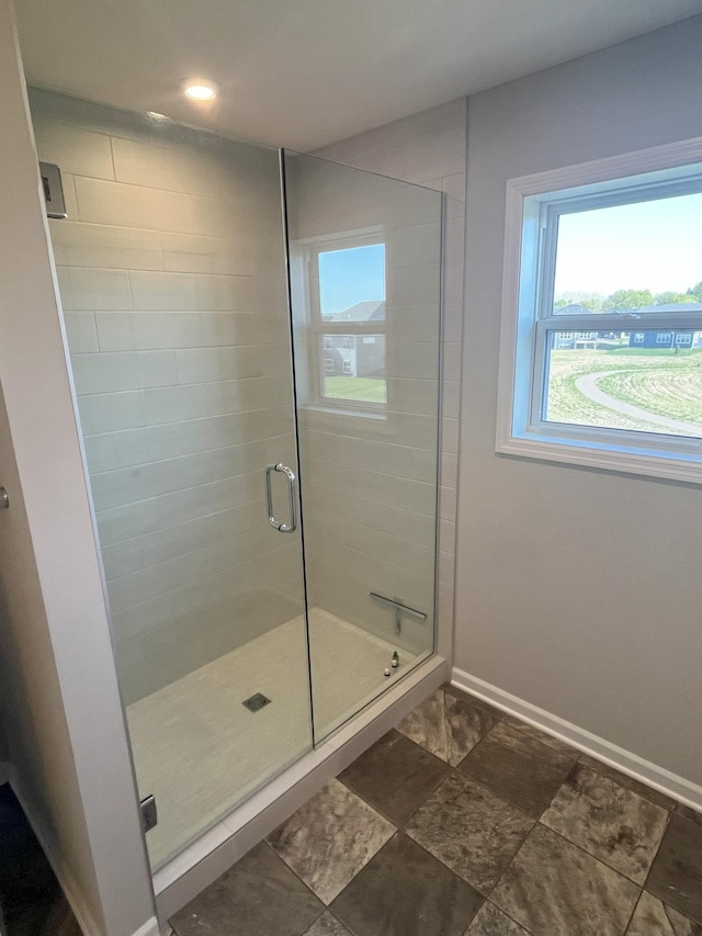 3790 Thrush St, Shakopee, MN 55379 - full bathroom featuring a stall shower and baseboards