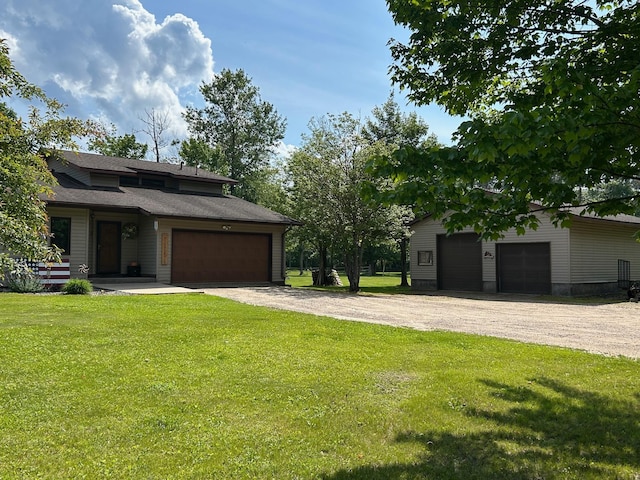 28599 Westwood Ln, Harris Twp, MN 55744 - view of grassy yard featuring a garage