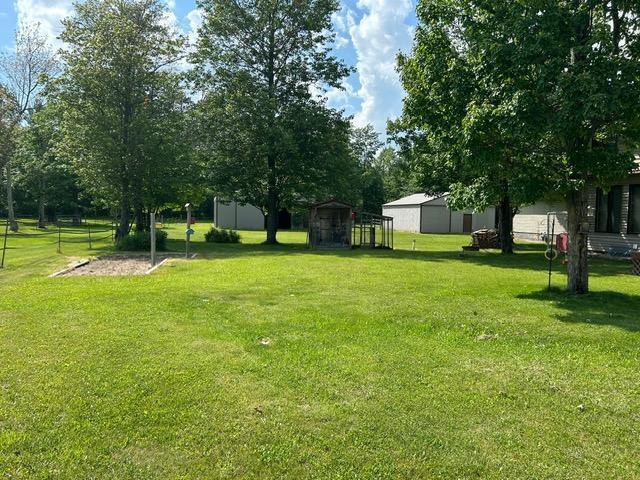 28599 Westwood Ln, Harris Twp, MN 55744 - view of grassy yard featuring an outbuilding