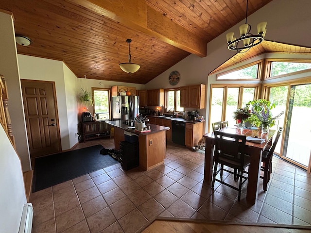 28599 Westwood Ln, Harris Twp, MN 55744 - kitchen with stainless steel fridge, dishwasher, dark countertops, a baseboard heating unit, and healthy amount of natural light