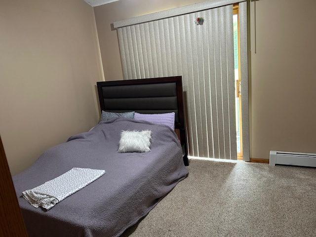 28599 Westwood Ln, Harris Twp, MN 55744 - carpeted bedroom featuring a baseboard radiator