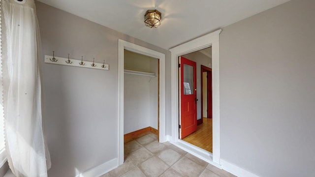 429 7th St NW, Rochester, MN 55901 - hallway with baseboards and light tile patterned flooring