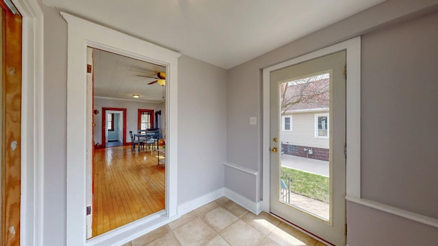 429 7th St NW, Rochester, MN 55901 - entryway with healthy amount of natural light, ceiling fan, ornamental molding, and light wood-type flooring