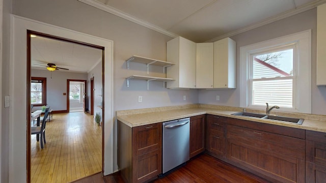 429 7th St NW, Rochester, MN 55901 - kitchen featuring dishwasher, ornamental molding, dark wood finished floors, and light countertops