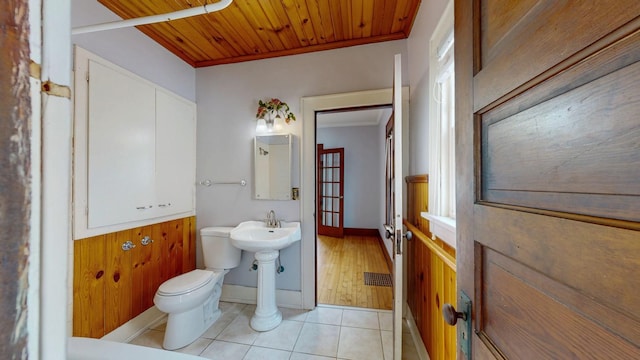 429 7th St NW, Rochester, MN 55901 - bathroom with tile patterned flooring, wooden ceiling, and ornamental molding