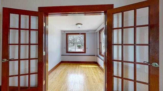 429 7th St NW, Rochester, MN 55901 - spare room featuring light wood-style flooring and french doors