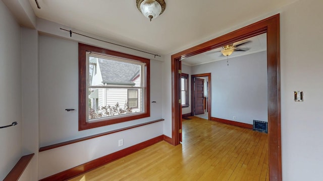 429 7th St NW, Rochester, MN 55901 - empty room with light wood-style flooring and a ceiling fan