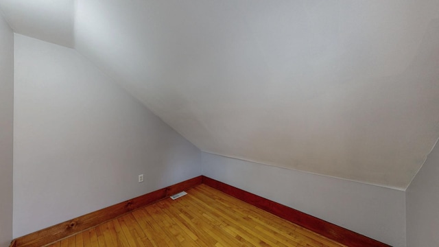 429 7th St NW, Rochester, MN 55901 - additional living space featuring lofted ceiling and light wood-style flooring