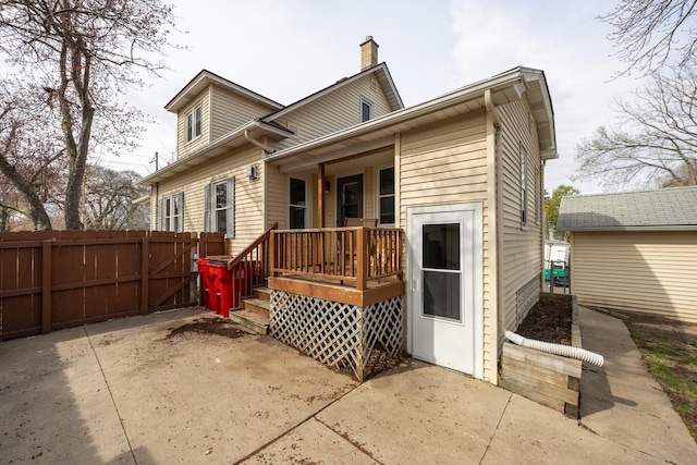 429 7th St NW, Rochester, MN 55901 - back of house with a porch, a chimney, and a gate