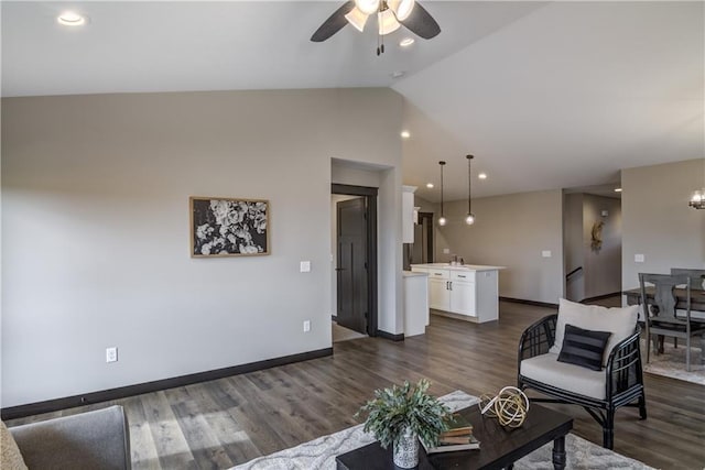 232 Chestnut St, Ellsworth, WI 54011 - living area featuring ceiling fan, dark wood-style flooring, vaulted ceiling, and recessed lighting