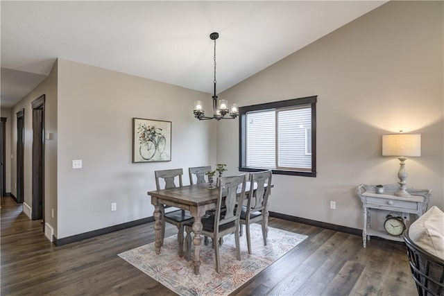 232 Chestnut St, Ellsworth, WI 54011 - dining area featuring a chandelier, lofted ceiling, and dark wood-type flooring